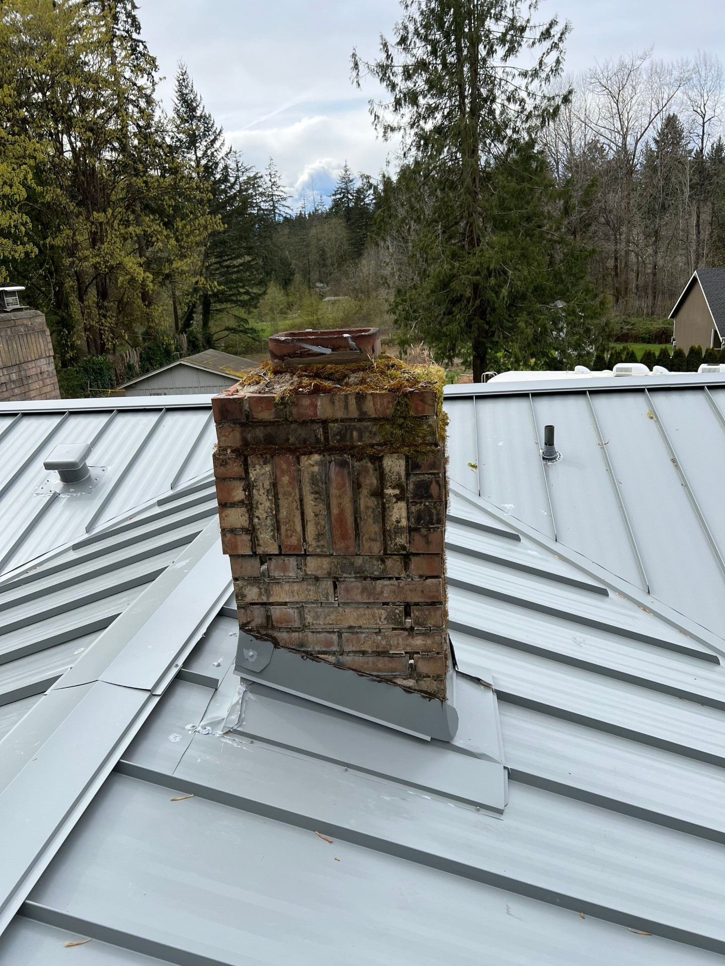 Metal roof around chimney